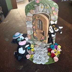 Whimsical Cow Figurine with Door and Flowers